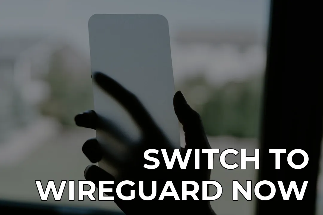 a hand holding a white card in front of a window — SWITCH TO WIREGUARD NOW